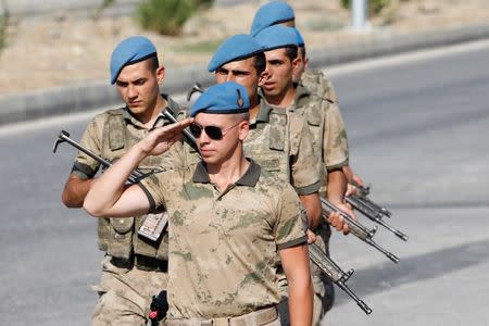 Turkish soldiers stand guard in front of the Aliaga Prison and Courthouse complex in Izmir, Turkey July 18, 2018. REUTERS/Kemal Aslan