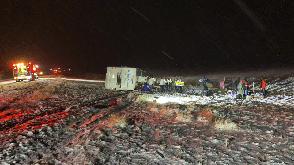This photo provided by the Utah Department of Public Safety shows an overturned Salt Lake express bus that had passengers when it overturned along eastbound on I-84 approximately 5 to 7 miles west of Tremonton, Utah, Monday, Dec. 12, 2022. The tour bus heading from Boise, Idaho to Salt Lake City, Utah crashed Monday morning, flipping onto its side and injuring dozens of passengers. Utah Highway Patrol said the majority of passengers aboard the bus sustained minor injuries from the crash. (Utah Highway Patrol/Utah Department of Public Safety via AP)