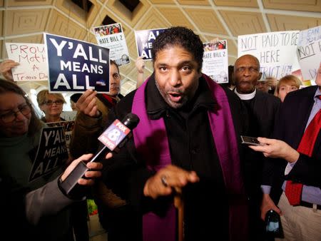 Civil rights leader Reverend William Barber, president of the NAACP in North Carolina, speaks to the media inside the state's Legislative Building as lawmakers gather to consider repealing the controversial HB2 law limiting bathroom access for transgender people in Raleigh, North Carolina, U.S. on December 21, 2016. REUTERS/Jonathan Drake