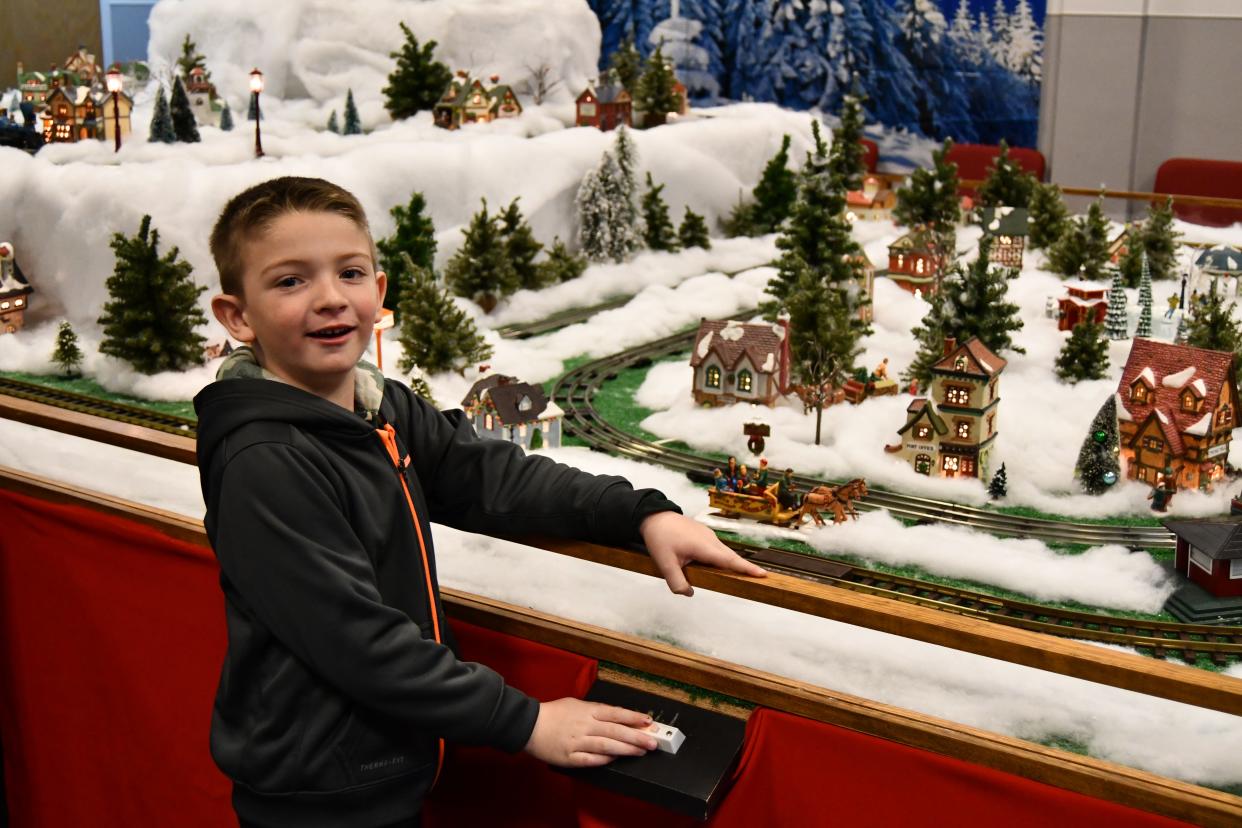 Neil Stark, 5, enjoys his first visit to the annual Hayes Train Special model train display, pressing the train whistle button and every other button in the interactive exhibit.