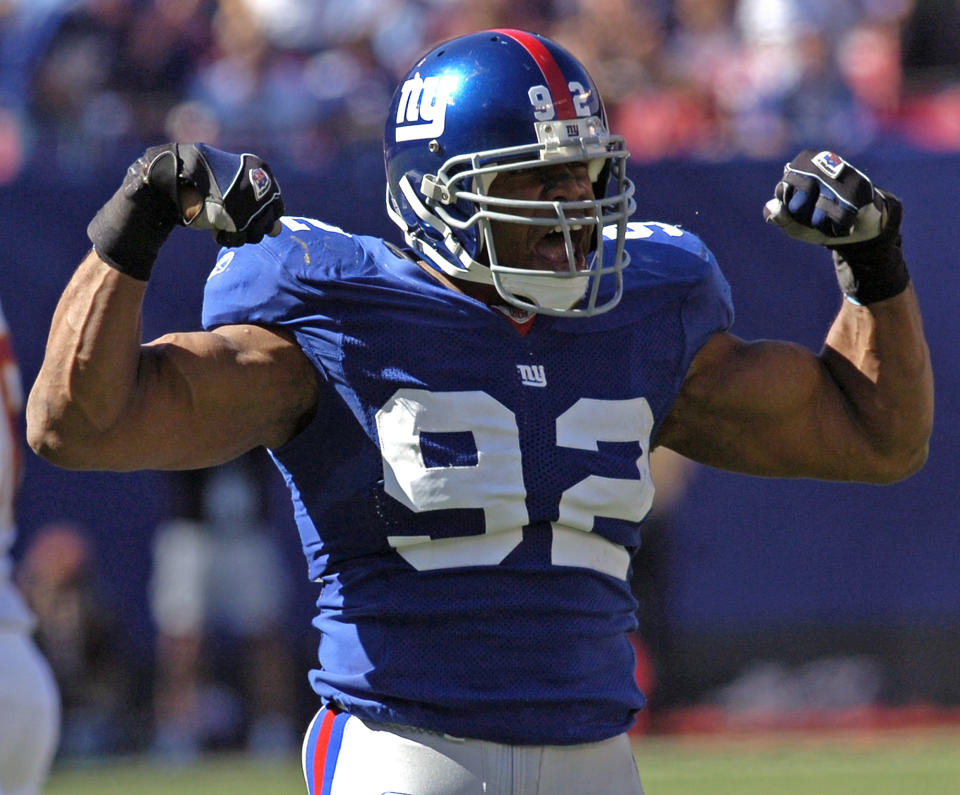 FILE - In this Oct. 8, 2006, file photo, New York Giants defensive end Michael Strahan reacts after sacking Washington Redskins quarterback Mark Brunell during second quarter NFL football at Giants Stadium in East Rutherford, N.J. Strahan was elected to the Pro Football Hall of Fame on Saturday, Feb. 1, 2014. (AP Photo/Bill Kostroun)