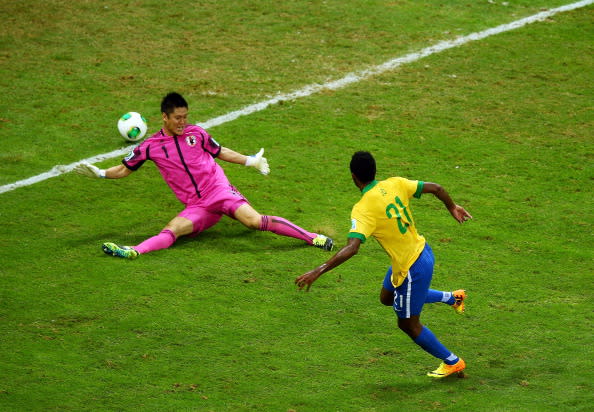 BRASILIA, BRAZIL - JUNE 15: Jo of Brazil scores his team's third goal past Eiji Kawashima of Japan during the FIFA Confederations Cup Brazil 2013 Group A match between Brazil and Japan at National Stadium on June 15, 2013 in Brasilia, Brazil. (Photo by Clive Mason/Getty Images)