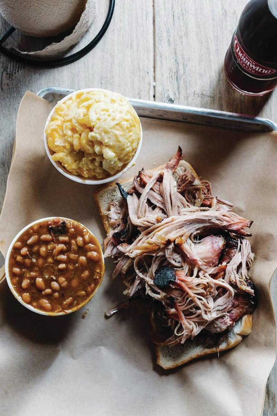 FILE - Southern Soul Barbeque's pulled pork, BBQ beans and potato salad. The St. Simons Island restaurant is one of many in Georgia featured on Food Network's "Diners, Drive-Ins and Dives" with Guy Fieri.