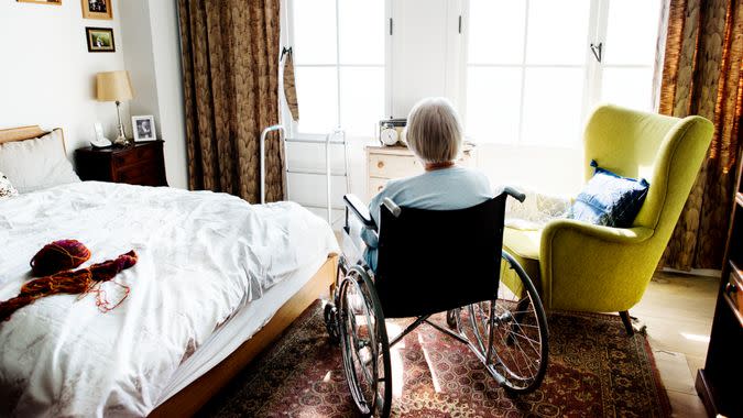 Senior woman sitting on the wheelchair alone.