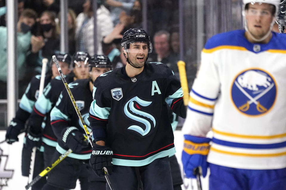 Seattle Kraken's Jordan Eberle skates ahead of teammates after scoring against the Buffalo Sabres during the second period of an NHL hockey game Thursday, Nov. 4, 2021, in Seattle. (AP Photo/Elaine Thompson)