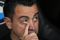 Barcelona's head coach Xavi Hernandez gestures as he attends the start of the Spanish La Liga soccer match between Real Madrid and Barcelona at the Santiago Bernabeu stadium in Madrid, Spain, Sunday, April 21, 2024. (AP Photo/Manu Fernandez)