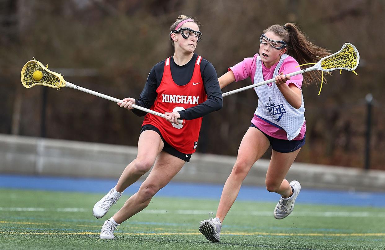 Hingham #3 Madeline Packard winds up to shoot as Scituate defender Izzy Adams moves in to block.
Scituate host Hingham girls lacrosse for a pre-season scrimmage on Friday March 29, 2024