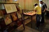 Students view the restored hand-written novels, the original editions of national hero Jose Rizal's books "Noli Me Tangere" (Touch Me Not) and "El Filibusterismo" (Reign of Greed) at the National Library in Manila in June 2011. Tropical conditions and the library's threadbare budget were big obstacles to saving them for future generations