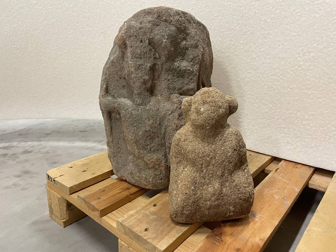 The Four Gods Stone (left) and the “giant” carving (right) sit together.