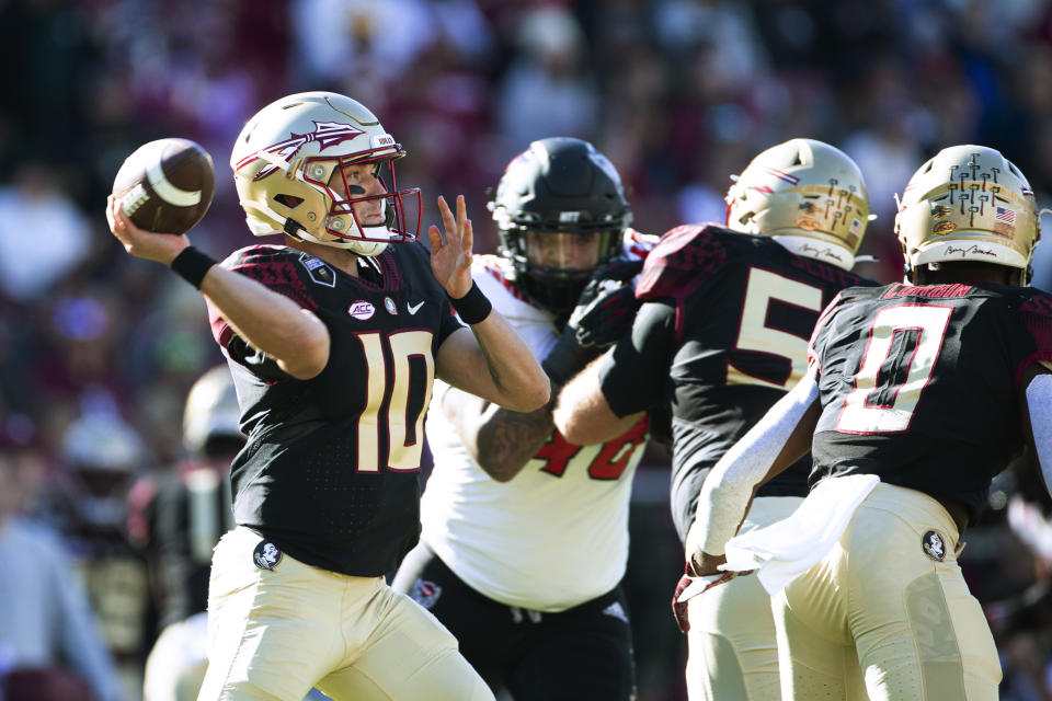 Florida State quarterback McKenzie Milton (10) throws a pass during the first half of the team's NCAA college football game against North Carolina State in Tallahassee, Fla., Saturday, Nov. 6, 2021. (AP Photo/Mark Wallheiser)