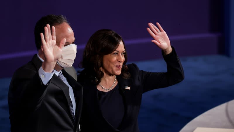 Democratic vice presidential candidate California Sen. Kamala Harris is greeted by her husband, Douglas Emhoff, at the end of the vice presidential debate, moderated by Susan Page, at Kingsbury Hall at the University of Utah in Salt Lake City on Wednesday, Oct. 7, 2020.