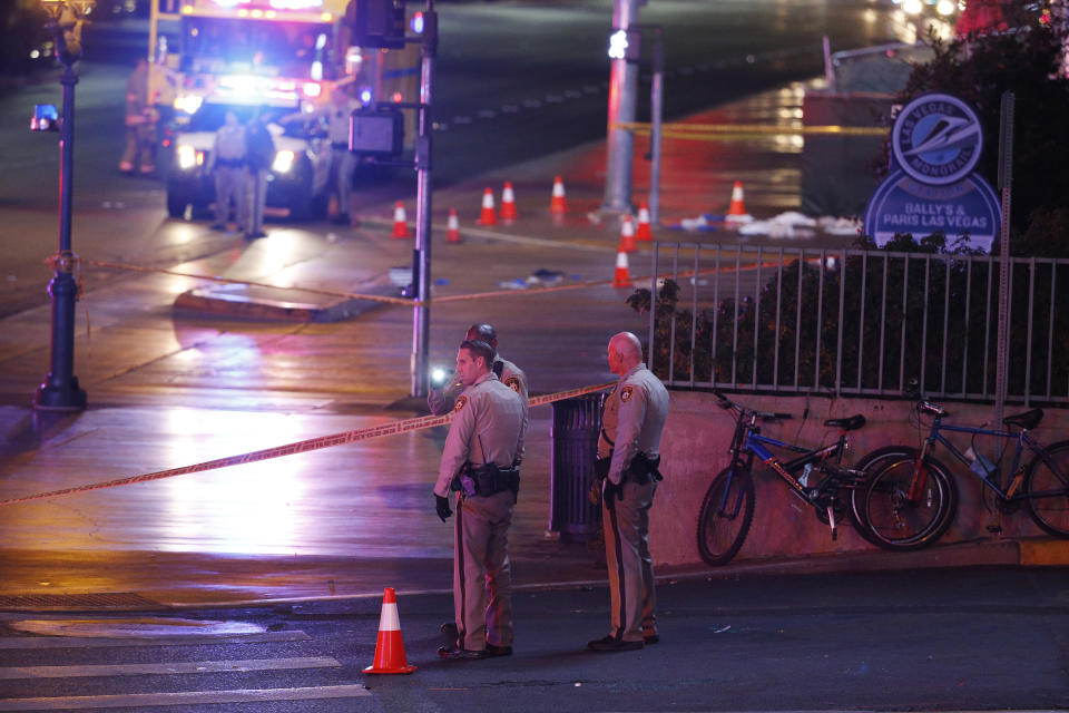 FILE - Police and emergency crews respond to the scene of an incident on Dec. 20, 2015, along a Las Vegas Strip sidewalk. Trial is being delayed for a woman who has been at state psychiatric facilities for more than seven years after being accused of intentionally plowing a car into pedestrians on a Las Vegas Strip sidewalk in December 2015. Paris Paradise Morton told a Nevada judge on Thursday, May 18, 2023, that she wants a different court-appointed attorney. (AP Photo/John Locher, File)