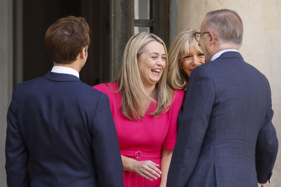 French President Emmanuel Macron, left, Australian Prime Minister Anthony Albanese's partner Jodie Haydon, Emmanuel Macron's wife Brigitte Macron, second right, and Australian Prime Minister Anthony Albanese share a laugh Friday, July 1, 2022 at the Elysee Palace in Paris. Australia and France opened a "new chapter" in relations as the new Australian prime minister seeks to heal wounds caused by a secret submarine contract that infuriated France. (AP Photo/ Thomas Padilla)