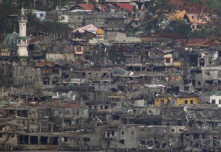 Damaged buildings and houses are seen as government troops continue their assault during clearing operations against pro-IS militants group which have seized control over large parts of Marawi City, Philippines September 11, 2017. REUTERS/Romeo Ranoco