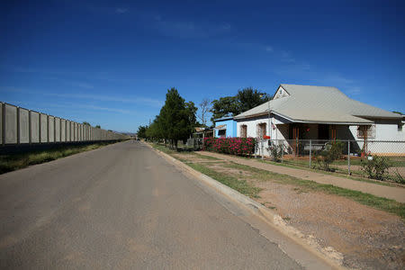 Residential homes are seen next to the fence that borders Mexico, in Douglas, Arizona, United States, October 10, 2016. REUTERS/Mike Blake