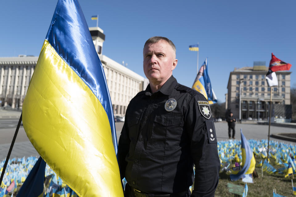 Ukrainian police officer Volodymyr Nikulin poses for a photo in downtown Kyiv, Monday March 11, 2024. Nikulin helped Associated Press journalists during the siege of Mariupol, in the early days of Russia's invasion of Ukraine in 2022, while filming "20 Days in Mariupol" which won the best documentary Oscar on Sunday night. (AP Photo/Bela Szandelszky)