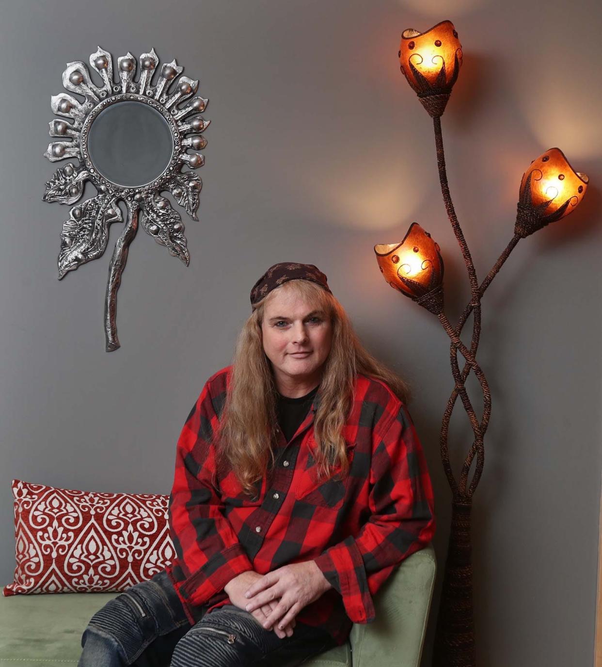 Julie Boylen, a trans woman, sits at the Community AIDS Network/Akron Pride Initiative (CANAPI) office in Akron where she works.