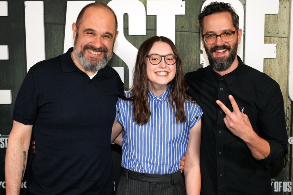 LOS ANGELES, CALIFORNIA - DECEMBER 04: (L-R) Craig Mazin, Bella Ramsey, and Neil Druckmann attend "The Last of Us" FYC Event at Paramount Theatre on December 04, 2023 in Los Angeles, California. (Photo by Jeff Kravitz/FilmMagic for HBO)