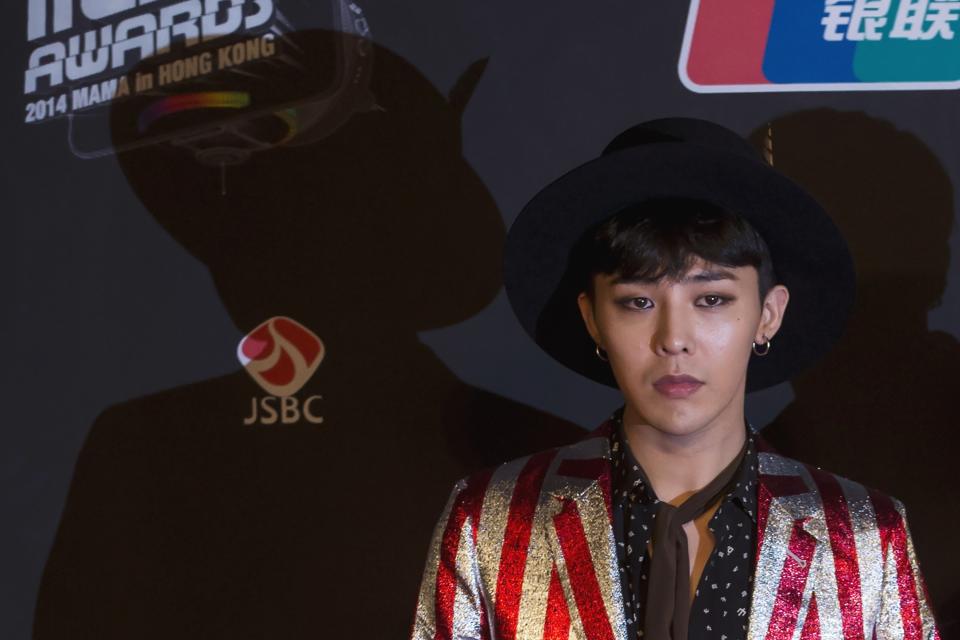 South Korean artist Kwon Ji-yong, stage name G-Dragon, a member of K-Pop idol group Big Bang, poses on the red carpet as he attends the 2014 Mnet Asian Music Awards (MAMA) in Hong Kong