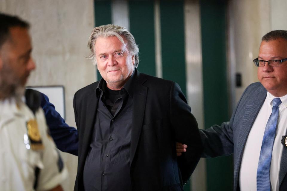 A handcuffed Steve Bannon is led to his arraignment in Manhattan Supreme Court on September 8, 2022.