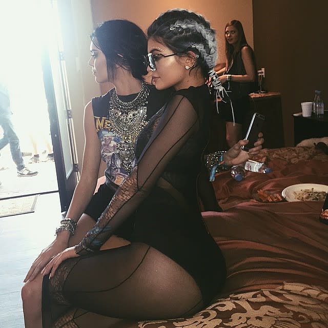 Is this what the 17 year olds are wearing these days? Kylie Jenner managed to one-up herself and even her sister's skin-baring styles when she celebrated the second weekend of the Coachella Valley Music and Arts Festival in Indio, Calif. by wearing a strange see-through, black bikini number. <strong> VIDEO: Kylie Jenner Says She Wants Kids in 10 Years </strong> With her curves on FULL display, Kylie added to the outfit by wearing gray braid extensions and huge sunglasses. She chose this outfit for her sister Khloe Kardashian's pool party that she called "Chella." <strong> PHOTOS: See the Star Styles at Coachella! </strong> In another pic, Kylie is posing with her older sis and her rumored 25-year-old boyfriend, rapper Tyga. But that wasn't the only scantily-clad style the <em>Keeping Up with the Kardashians </em>star chose to share on Instagram during her desert weekend. She also posted front and rear pics of her wearing a skimpy black bikini. In her next Instagram, Kylie debuted a boots-and-pantsless combo that she paired with pink hair. Upon her return to Calabasas, the teenage reality star couldn't help but post another bikini pic. "Chill pool day at the Disick mansion," she wrote while at her sister Kourtney's 36th birthday bash. <strong>What do you think of Kylie's style statements? Are they age appropriate?</strong>