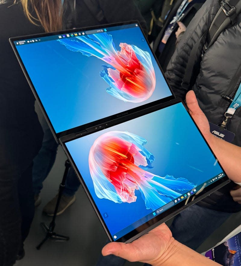 Asus Zenbook Dou being held by a Gizmodo reporter. 