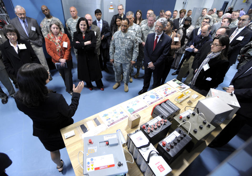 Electric engineer energy storage team leader Sonya Zanardelli, left, talks about the Energy Storage Lab where all types of batteries are tested for performance and durability, Wednesday, April 11, 2012 in Warren, Mich. The U.S. Army unveiled a new laboratory Wednesday that can simulate Afghanistan's desert heat and Antarctica's extreme cold in an effort to discover how to save energy and make combat vehicles fuel-efficient. (AP Photo/Detroit News, Todd McInturf ) DETROIT FREE PRESS OUT; HUFFINGTON POST OUT