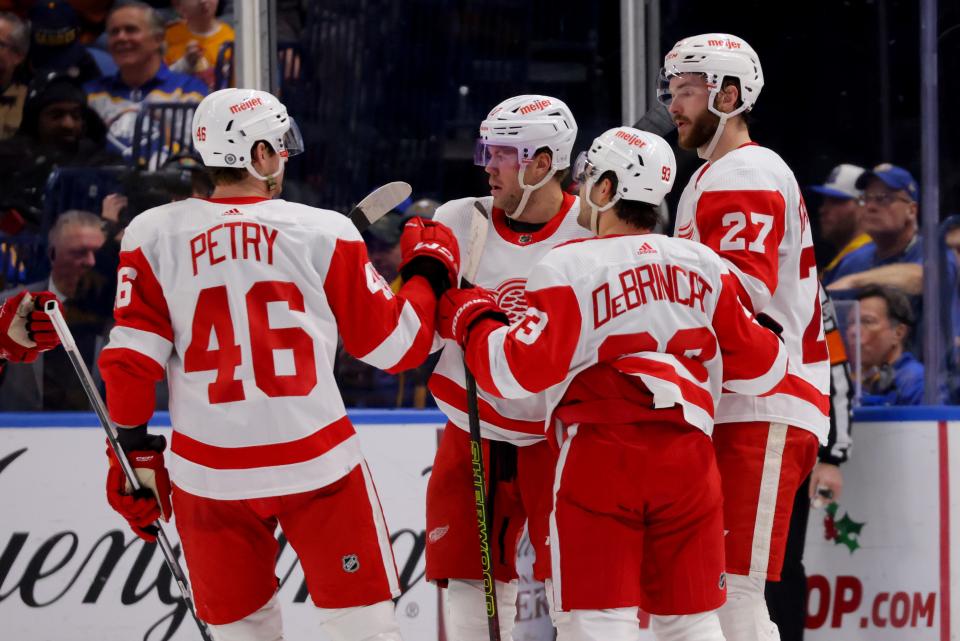 Red Wings center Michael Rasmussen (27) celebrates his goal with teammates during the second period of the Wings' 5-3 win on Tuesday, Dec. 5, 2023, in Buffalo, New York.