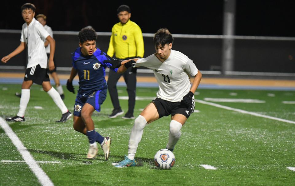 Pacifica's Omar Ochoa (right) tries to get away from Channel Islands' Emiliano Lievanos during the teams' CIF-SS Division 2 first-round match at Channel Islands on Feb. 9. Pacifica won 3-0.