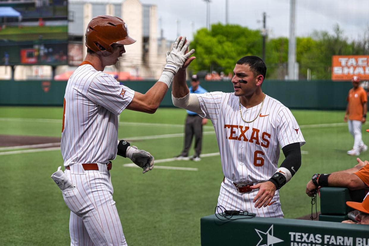 Texas Longhorns catcher Rylan Galvan (6) celebratees a home run by outfielder Will Gasparino (8) during the game against Washington at UFCU Disch–Falk Field on Saturday, March. 16, 2024 in Austin.