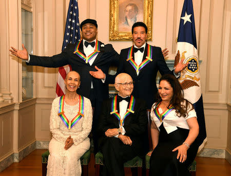 2017 Kennedy Center Honorees (seated L-R) dancer,actress and choreographer Carmen de Lavallade, TV writer Norman Lear, Cuban-American singer Gloria Estefan and (standing L-R) Rapper LL Cool J and singer and songwriter Lionel Ritchie pose for a group photo at the conclusion of a gala dinner at the U.S. State Department, in Washington, U.S., December 2, 2017. REUTERS/Mike Theiler