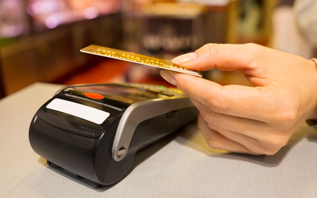 Analysis of payment provider Worldpay's own data found that in June 51 per cent of all card payments in shops were by tap-and-go cards, up from 50 per cent in May - © MIKA - Images / Alamy