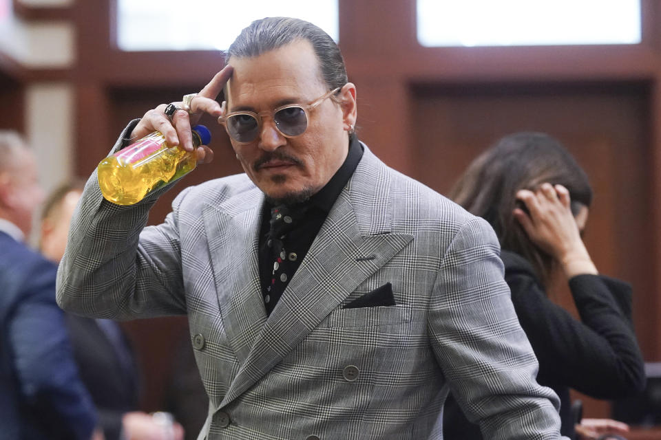 Actor Johnny Depp appears in the courtroom during a break at the Fairfax County Circuit Courthouse in Fairfax, Va., Thursday, May 19, 2022. Actor Johnny Depp sued his ex-wife Amber Heard for libel in Fairfax County Circuit Court after she wrote an op-ed piece in The Washington Post in 2018 referring to herself as a "public figure representing domestic abuse." (Shawn Thew/Pool Photo via AP)