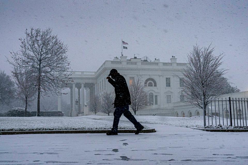 January 3, 2022:  Snow falls at the White House in Washington.