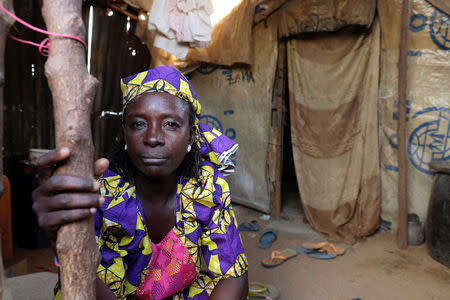 Zainab Bukar, an internally displaced person living in Bama camp, Nigeria, poses for a picture in her shelter November 23, 2017. Picture taken November 23, 2017. REUTERS/Paul Carsten