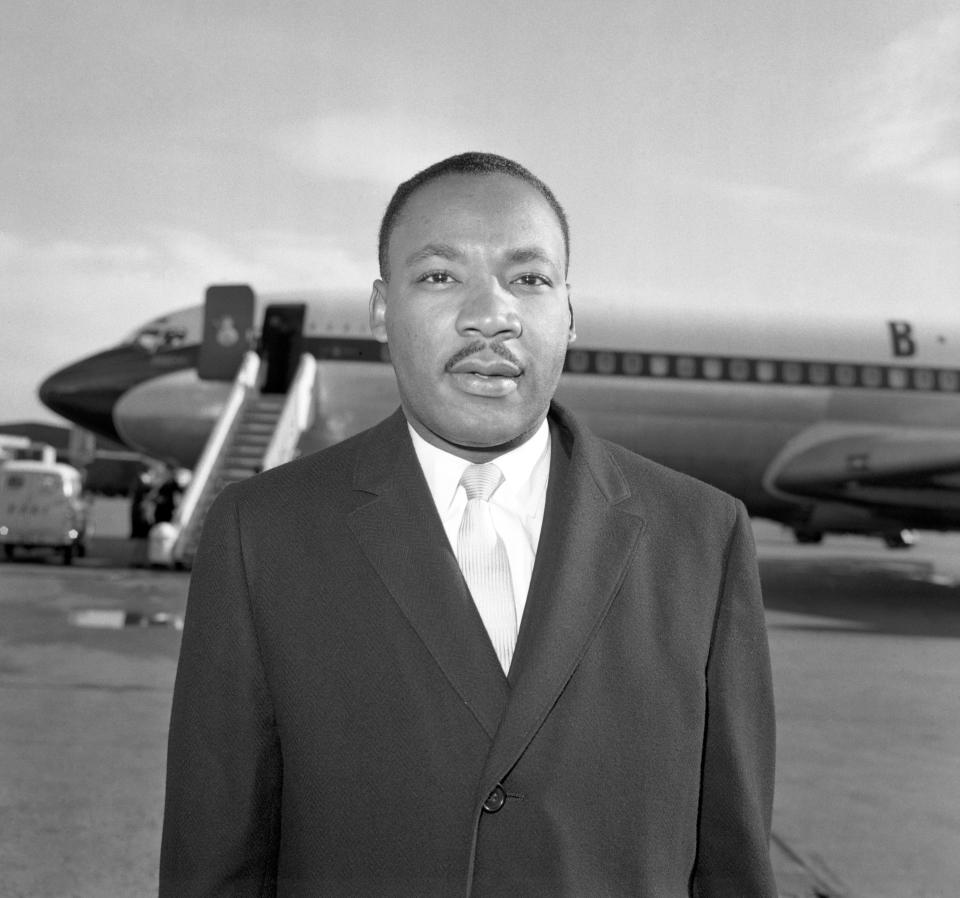 Dr Martin Luther King arriving at Heathrow Airport from New York. He is due to appear on the BBC's Face to Face during his four day visit, as well as delivering a sermon at Bloomsbury's Central Baptist Church.