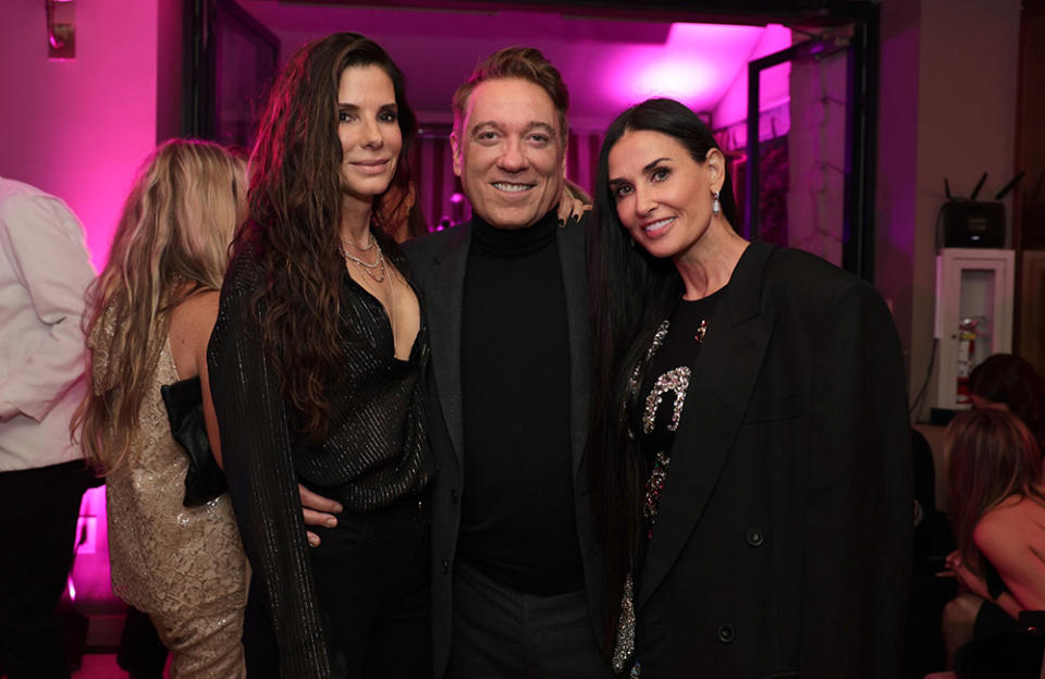 (L-R) Sandra Bullock, Kevin Huvane, and Demi Moore attend the The CAA Pre-Oscar Party at Sunset Tower Hotel on March 10, 2023 in Los Angeles, California.