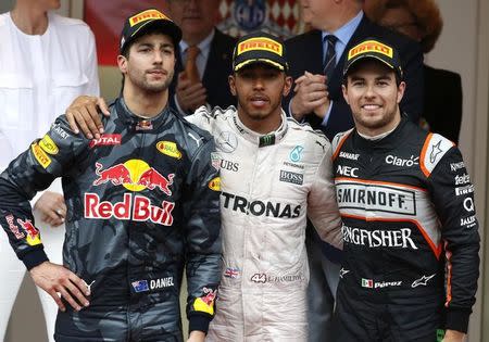 Formula One - Monaco Grand Prix - Monaco - 29/5/16. Mercedes F1 driver Lewis Hamilton (C) poses with Red Bull Racing F1 driver Daniel Ricciardo (L) and Sahara Force India F1 driver Sergio Perez. REUTERS/Eric Gaillard