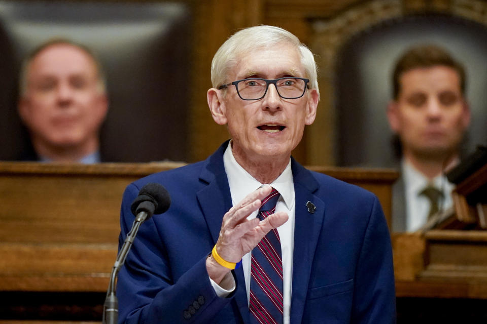 FILE - Wisconsin Gov. Tony Evers addresses a joint session of the Legislature in the Assembly chambers at the state Capitol in Madison, Wis. on Feb. 15, 2022. Wisconsin Democrats gathering for their annual state convention this weekend are focused on reelecting Gov. Evers and defeating Republican Sen. Ron Johnson, but also know that history is against them in the midterm year as voters face high inflation, rising gas prices and growing concerns about a recession. Evers and Democratic candidates seeking to take on Johnson are slated to speak at the convention. (AP Photo/Andy Manis, File)