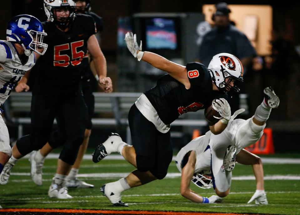 Republic's Kanon Krol carries the ball downfield during a game against Carthage at Republic Tigers Stadium on Friday, Aug. 25, 2023.