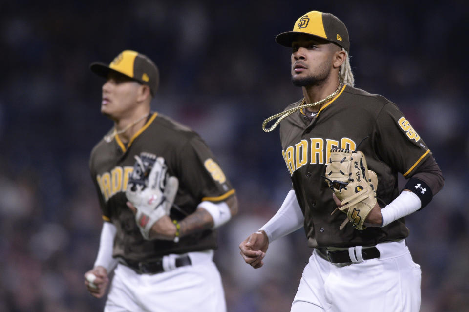 The future is now in San Diego. How Manny Machado (left) and Eric Hosmer helped talk Padres owner Ron Fowler into promoting Fernando Tatis Jr. (AP Photo/Orlando Ramirez)