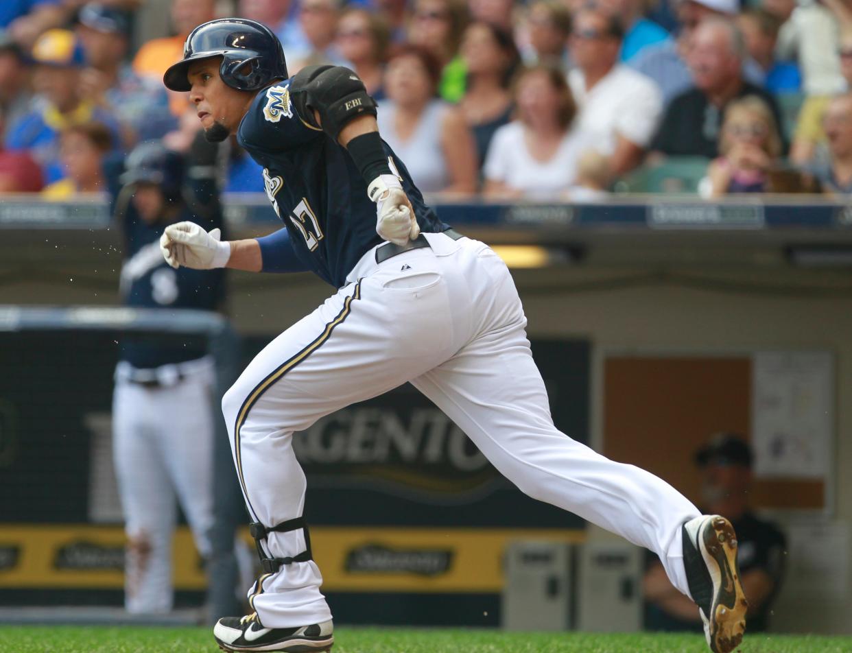 Milwaukee Brewers center fielder Carlos Gomez (27) watches his double during the second inning of their game against the Pittsburgh Pirates Sunday, August 24, 2014 at Miller Park in Milwaukee.