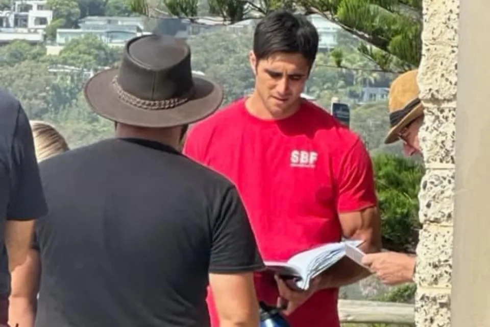 Ethan Browne as Tane Parata looking at a script on Home and Away.