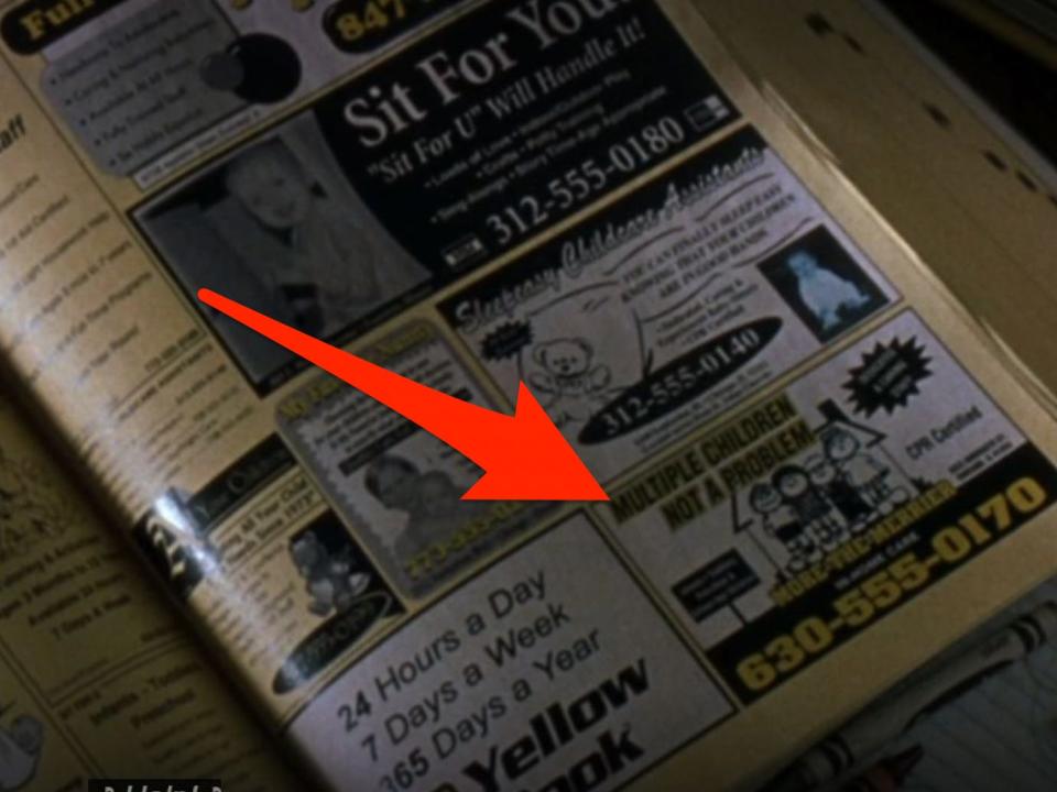 arrow pointing at an ad in a phonebook in a scene from cheaper by the dozen