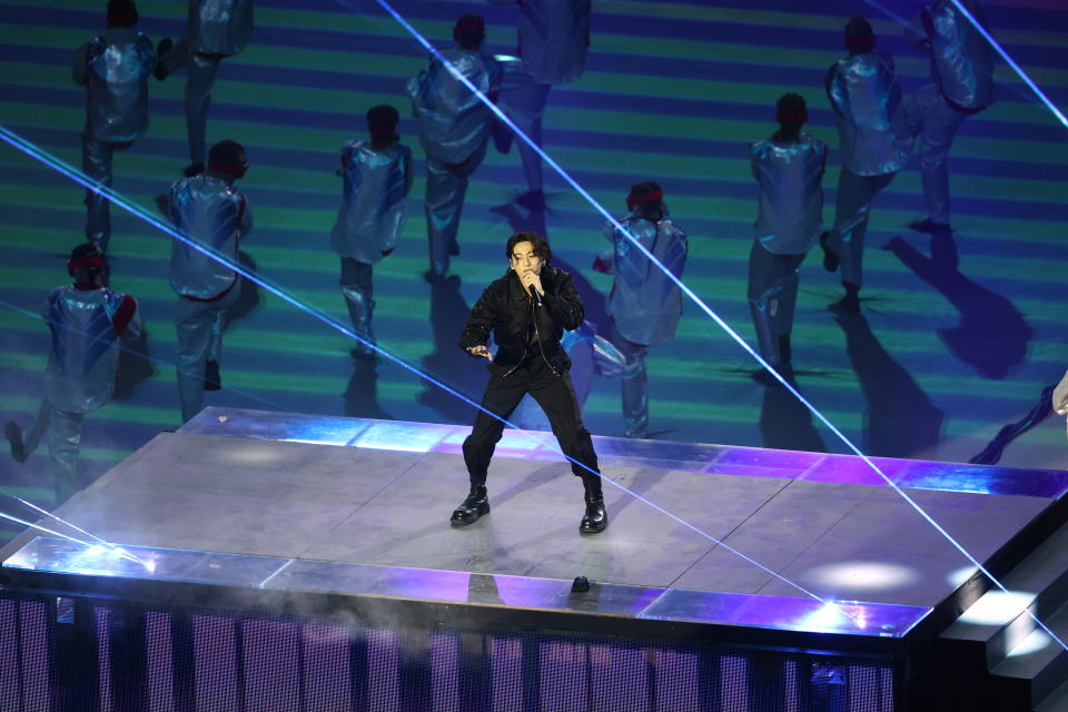 AL KHOR, QATAR - NOVEMBER 20: South Korean band BTS performs during the official opening ceremony of FIFA World Cup Qatar 2022 ahead of the opening match between Qatar and Ecuador at Al Bayt Stadium, in Al Khor, north of Doha, Qatar on November 20, 2022. (Photo by Evrim Aydin/Anadolu Agency via Getty Images)