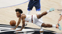 Cleveland Cavaliers guard Collin Sexton (2) is fouled by Dallas Mavericks forward Dorian Finney-Smith during the first half of an NBA basketball game, Friday, May 7, 2021, in Dallas. (AP Photo/Brandon Wade)