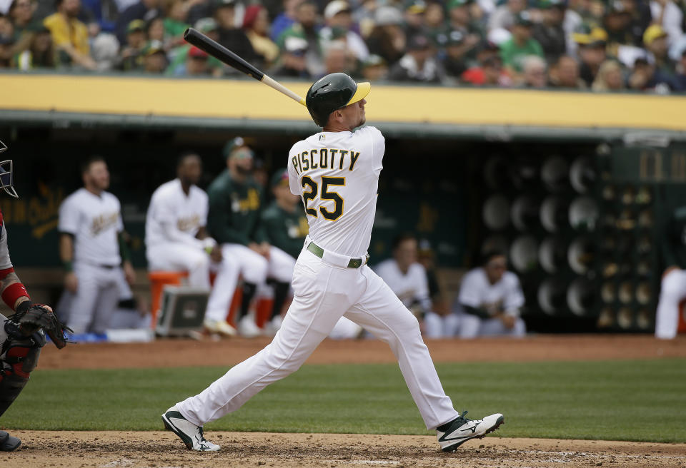Oakland Athletics' Stephen Piscotty hits a three-run home run off Boston Red Sox starting pitcher Eduardo Rodriguez in the third inning of a baseball game Thursday, April 4, 2019, in Oakland, Calif. (AP Photo/Eric Risberg)