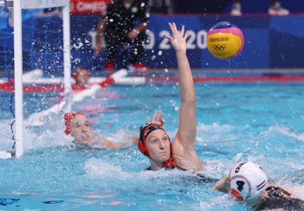 Kyra Christmas of Canada in action during a loss against the Netherlands at the Tatsumi Water Polo Centre on Sunday in Tokyo. (Gonzalo Fuentes/Reuters - image credit)