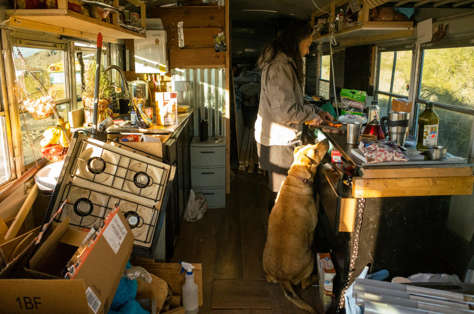 Paula prepares breakfast while Button, the family dog, begs for scraps.<span class="copyright">Nina Riggio for TIME</span>