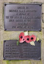 A close-up taken on Wednesday, Feb. 13, 2019 of the memorial honouring 10 U.S. airmen who died in a plane crash on Feb. 22, 1944 in Endcliffe Park, Sheffield, England. Tony Foulds was just a kid running around in the park when a U.S. Air Force crew decided to crash and die rather than take the chance of hitting them. He's dreamed of honoring them for decades. Now he's 82 and about to get his wish. (AP Photo/Rui Vieira)